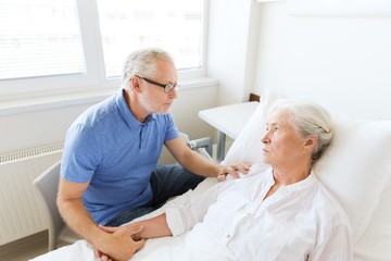 senior couple meeting at hospital ward