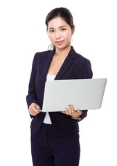 Young Businesswoman use of the laptop computer