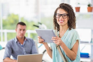 Creative businesswoman holding digital tablet