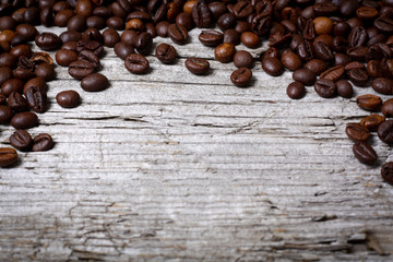 Fototapeta premium Coffee beans on wood background