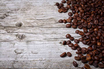 Coffee beans on wood background