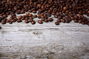 Coffee beans on wood background