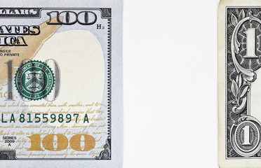 Macro shot of a new 100 dollar bill and one dollar isolate on white background