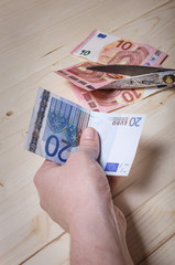 Euro banknote in hand