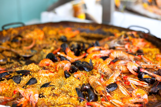 Traditional paella with seafood in a market