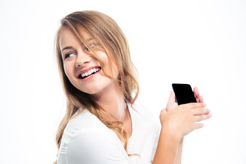 Smiling young girl holding smartphone