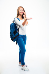 Happy female student talking on the phone