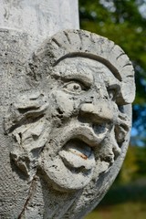 Ugly stone face sculpture