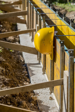 Yellow hardhat on a building site