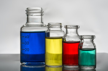 Set of laboratory bottles with color liquid
