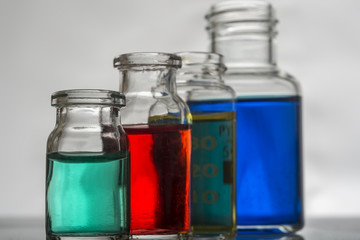 Set of laboratory bottles with color liquid
