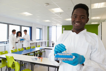 Group Of College Students In Science Class With Experiment