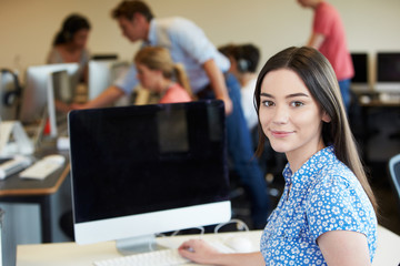 Female College Student Using Computer In Classroom