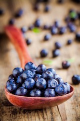 Fresh organic blueberries in a spoon