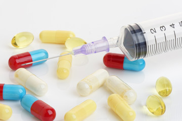 Hypodermic Needle and Capsules. Macro Health Concept