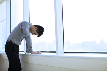 Depressed young business man  in office