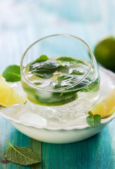A Glass of fresh Mojito cocktail on ice cubes