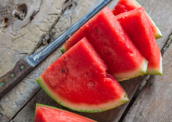 Pieces of watermelon on a wooden table