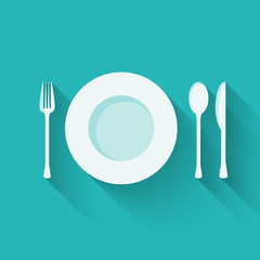 Plate with cutlery (fork, spoon and knife) long shadows