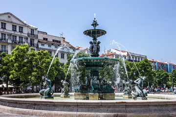 Fototapeta na wymiar Rossio square with fountain located at Baixa district in Lisbon