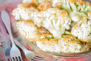 Fried cauliflower closeup on the plate on a table