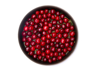 Top view of red cherry in round baking tin