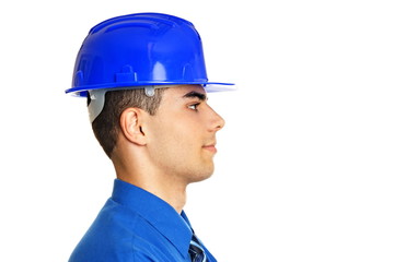 Profile of young businessman in a protective helmet, right you write some text