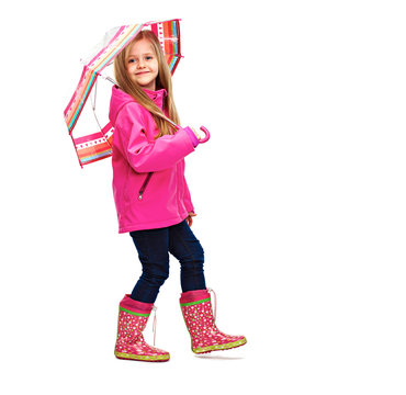 Little girl posing in fashion style wearing autumn clothing.