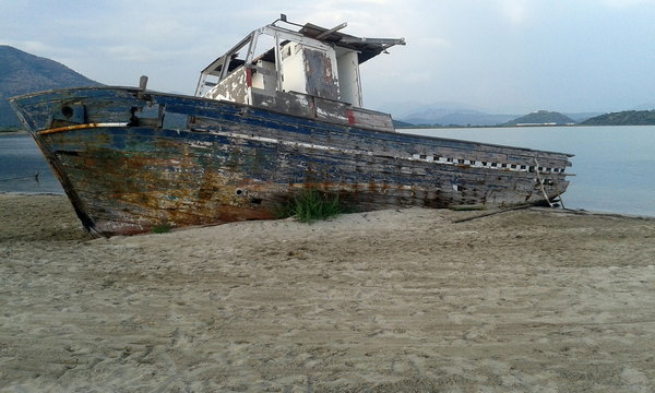 Shipwrecked boat on beach