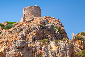 Fototapeta na wymiar Ancient Genoese tower on Capo Rosso, Corsica