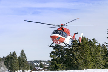 Fototapeta na wymiar Landing a helicopter rescue service in the mountains.