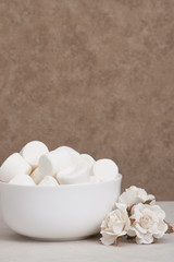 Heap Of Marshmallows In White Bowl. Paper Roses
