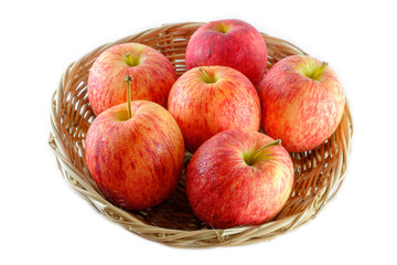 Fresh of apples on a basket isolated on white background