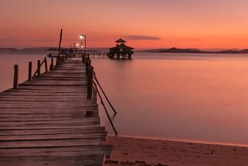Fototapeta na wymiar The dock on the ocean in the island of kanawa, indonesia
