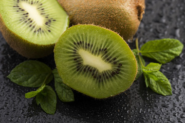 Juicy kiwi fruit and freas mint leaves