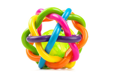 Colorful plastic rattle ball for developing motor skills isolated on the white background