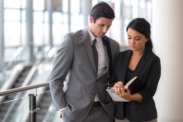 Man and woman business executive attorney in a suit team secretary leader