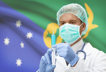 Doctor with syringe in hands and flag on background series - Christmas Island