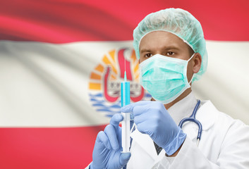 Fototapeta premium Doctor with syringe in hands and flag on background series - French Polynesia
