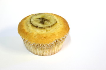 Banana muffin, isolated on white background.