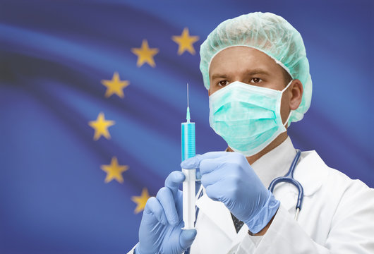 Doctor with syringe in hands and flag on background series - European Union - EU