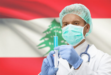 Doctor with syringe in hands and flag on background series - Lebanon