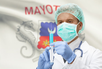 Doctor with syringe in hands and flag on background series - Mayotte