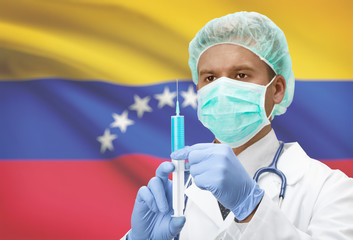 Doctor with syringe in hands and flag on background series - Venezuela