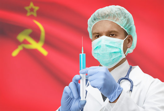 Doctor with syringe in hands and flag on background series - USSR - Soviet Union