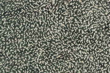 White dots on black stone texture