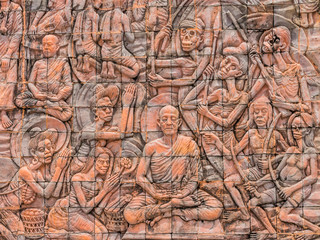 Fototapeta na wymiar Bas-relief wall in Phu-tok Temple, Bueng kan, Thailand