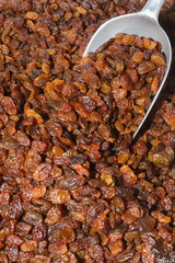 Basket of sun raisins at an open air food market bazaar.