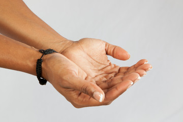 cupped hands to receive