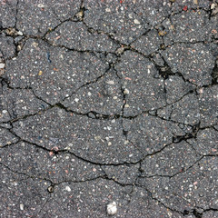 Obraz premium Old aged weathered cracked tarmac texture large damaged asphalt macro closeup